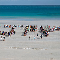 Community gather at Cable Beach to spell No Gas at James Price Point